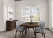 Thumbnail 5 of 40 - a dining room with a table and chairs and a window