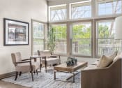 Thumbnail 22 of 32 - a living room with a couch and chairs and large windows at Arcadia Apartments, Colorado, 80112