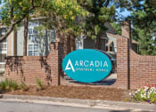 Thumbnail 32 of 32 - our sign in front of a brick building at Arcadia Apartments, Colorado, 80112