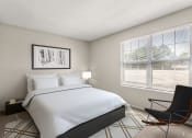 Thumbnail 14 of 32 - a bedroom with a large bed and a window at Arcadia Apartments, Centennial, CO 80112