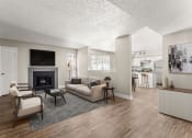 Thumbnail 13 of 32 - a living room with a couch and chairs and a fireplace at Arcadia Apartments, Colorado, 80112