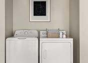 Thumbnail 18 of 32 - a washer and dryer in a laundry room at Arcadia Apartments, Centennial