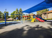 Thumbnail 23 of 50 - a playground with slides and swings  at Citrine Hills, Ontario, CA
