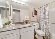 Thumbnail 8 of 50 - a bathroom with a white sink and toilet next to a shower with a black and white shower  at Citrine Hills, Ontario, 91761