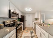 Thumbnail 2 of 50 - a kitchen with white cabinets and stainless steel appliances  at Citrine Hills, California, 91761
