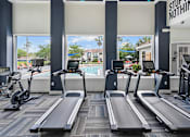 Thumbnail 14 of 38 - A gym with treadmills and elliptical machines. at Country Club Lakes, Jacksonville, Florida