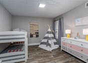 Thumbnail 5 of 19 - A child's bedroom with a bunk bed, a teepee, and a dresser.