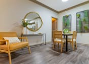 Thumbnail 2 of 30 - a living room with a table and chairs and a mirror at Summerwind, Pearland, TX 77584