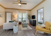 Thumbnail 3 of 30 - a living room with a ceiling fan and a couch at Summerwind, Pearland, TX
