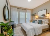 Thumbnail 6 of 30 - a bedroom with a large bed and a large window at Summerwind, Pearland Texas