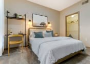 Thumbnail 5 of 30 - a bedroom with a large bed and a mirror
