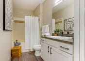 Thumbnail 7 of 30 - a bathroom with a sink and a toilet and a shower at Summerwind, Pearland