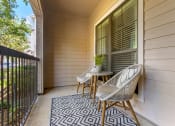 Thumbnail 4 of 30 - a balcony with a chair and a table on it at Summerwind, Texas