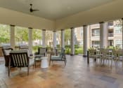 Thumbnail 18 of 30 - an outdoor patio with tables and chairs at Summerwind, Texas, 77584