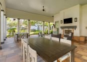 Thumbnail 20 of 30 - a dining room with a table and chairs and a fireplace at Summerwind, Pearland