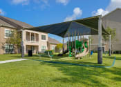 Thumbnail 27 of 30 - our apartments have a playground with a variety of play equipment at Summerwind, Pearland