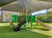 Thumbnail 26 of 30 - a playground with a play set under a canopy at Summerwind, Pearland, TX
