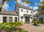 Thumbnail 16 of 30 - the front of a house with a brick walkway and a fountain at Summerwind, Pearland, TX