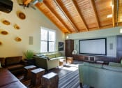 Thumbnail 19 of 25 - a living room filled with furniture and a large flat screen tv at The Lakes Apartments, Washington