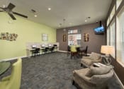 Thumbnail 27 of 29 - a living room with couches and a table with chairs and a tv at Veranda at Centerfield, Texas, 77070
