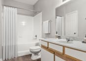 Thumbnail 15 of 29 - a bathroom with a sink and a toilet and a shower at Veranda at Centerfield, Houston