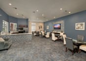 Thumbnail 26 of 29 - a conference room with a table and chairs and a television at Veranda at Centerfield, Texas