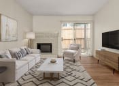 Thumbnail 12 of 31 - a living room with a white couch and a fireplace and a tv at South Lamar Village, Austin