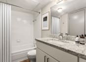 Thumbnail 15 of 31 - a bathroom with a sink and a toilet and a shower at South Lamar Village, Texas