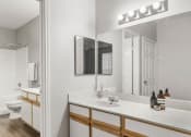 Thumbnail 14 of 29 - a bathroom with a sink and a mirror at Veranda at Centerfield, Houston, Texas