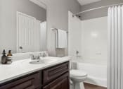 Thumbnail 13 of 29 - a bathroom with a sink and a toilet and a shower at Veranda at Centerfield, Houston