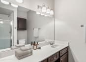 Thumbnail 12 of 29 - a bathroom with a sink and a mirror at Veranda at Centerfield, Houston