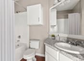 Thumbnail 5 of 28 - a bathroom with a sink toilet and a bath tub at Villages of Cypress Creek, Houston, TX, 77070