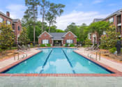 Thumbnail 14 of 28 - a swimming pool with a house in the background at Villages of Cypress Creek, Houston, Texas