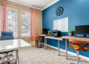 Thumbnail 22 of 28 - a room with a desk with a computer and a window at Villages of Cypress Creek, Houston, Texas