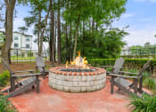 Thumbnail 12 of 28 - fire pit with chairs and a table and trees at Villages of Cypress Creek, Texas