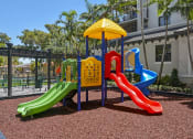 Thumbnail 18 of 22 - outdoor play ground | District West Gables Apartments in West Miami, Florida