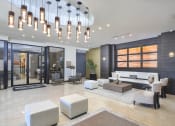 Thumbnail 7 of 22 - clubhouse lobby lounge area | District West Gables Apartments in West Miami, Florida