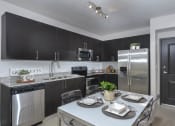 Thumbnail 1 of 22 - gourmet kitchen with granite countertops | District West Gables Apartments in West Miami, Florida