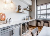 Thumbnail 23 of 33 - a kitchen with a large window and a table with chairs at The links at Plum Creek Apartments, Castlerock