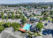 Thumbnail 91 of 105 - A residential area with houses and a swimming pool.