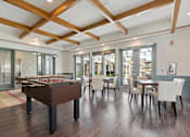 Thumbnail 60 of 105 - A room with a pool table and a dining table.