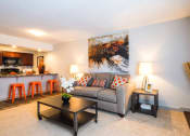 Thumbnail 5 of 17 - a living room with a couch and a table at Skyview Apartments, Colorado, 80234