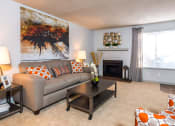 Thumbnail 4 of 17 - a living room with a couch and a coffee table at Skyview Apartments, Westminster