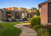 Thumbnail 31 of 31 - a view of a building with cars parked in a parking lot at South Lamar Village, Texas, 78704