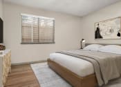 Thumbnail 14 of 31 - a bedroom with a bed and a window at South Lamar Village, Austin, 78704