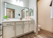Thumbnail 8 of 35 - a bathroom with a large mirror and a sink