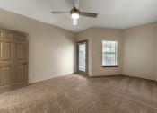 Thumbnail 15 of 35 - an empty room with a door and a window