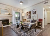 Thumbnail 6 of 19 - a living room with a couch and a fireplace at The Olivine, Austin, Texas