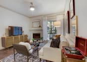 Thumbnail 7 of 19 - a living room with a white couch and a fireplace at The Olivine, Austin, Texas