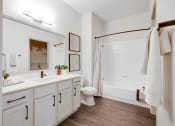 Thumbnail 10 of 19 - a bathroom with a sink and a toilet and a shower at The Olivine, Austin, TX